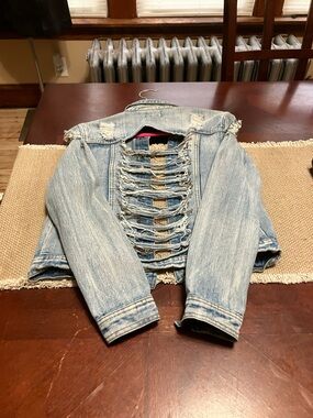 Distressed Light Blue Denim Jacket with Ladder Back Detail